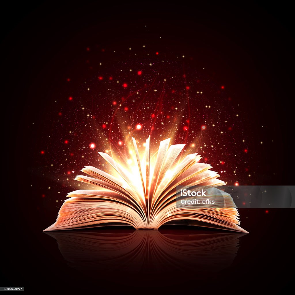 Magic book with magic lights Opened magic book Book Stock Photo