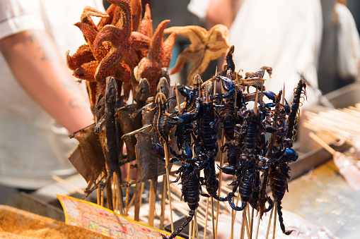 This is a shot from the Beijing markets and is of a variety of bugs on skewers, ready to be deep friedThis is a shot from the Beijing markets and is of a variety of bugs on skewers, ready to be deep fried