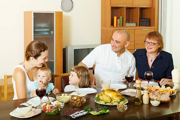 istock happy  three generations family over dining table at home 528374437