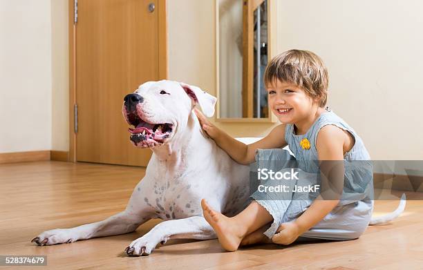 Small Smiling Girl On The Floor With Dog Stock Photo - Download Image Now - 2-3 Years, Animal, Cheerful