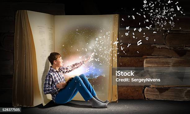 Guy Reading Book Stock Photo - Download Image Now - Child, Adult, Book