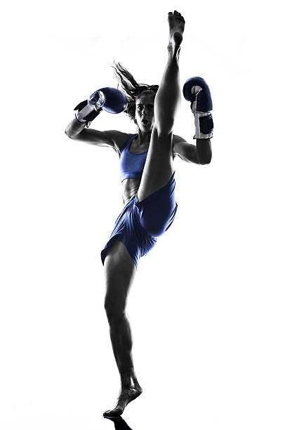 istock woman boxer boxing kickboxing silhouette isolated 528387067