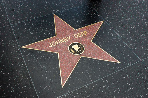 Los Angeles, USA - April 18, 2014: Johnny Depp star on Hollywood Walk of Fame in Hollywood, California. This star is located on Hollywood Blvd. and is one of over 2000 celebrity stars embedded in the sidewalk.