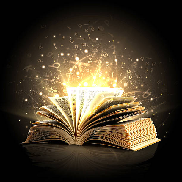 Magic book with magic lights and letters Opened magic book with blowing white letters bible art library stock pictures, royalty-free photos & images