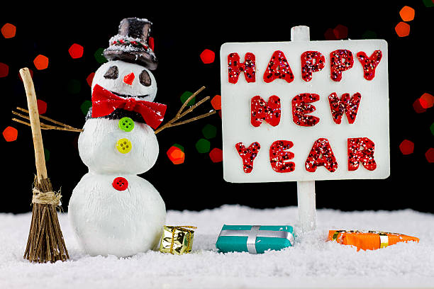 istock Snowman with a Happy New Year signpost 528389775