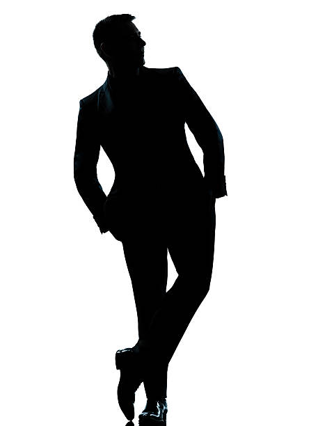 istock one business man standing Full length hands in pocket silhouette 528389801