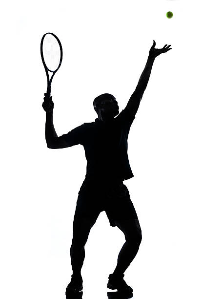 istock man tennis player at service silhouette 528389903