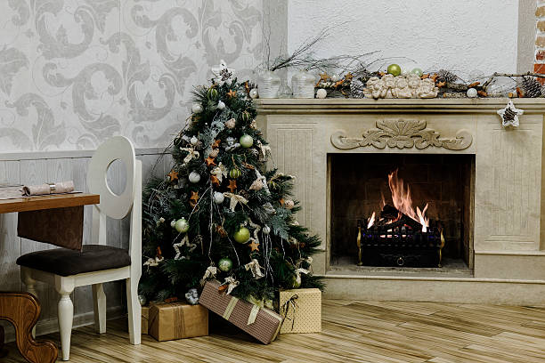 istock Christmas tree next to vintage fireplace 528390687