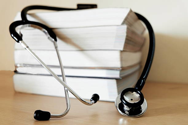 istock Stethoscope and piles of books 528391097