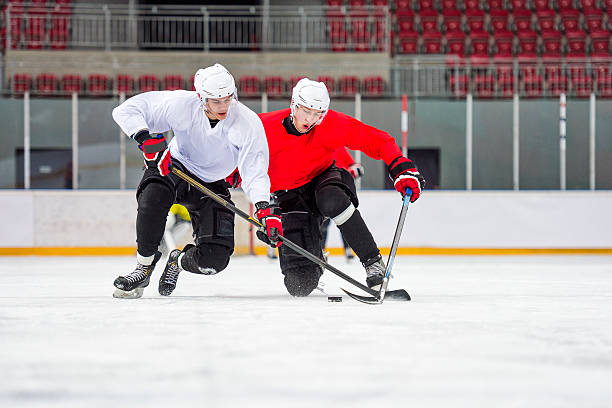 istock Two Ice Hockey Players Dueling 528391163