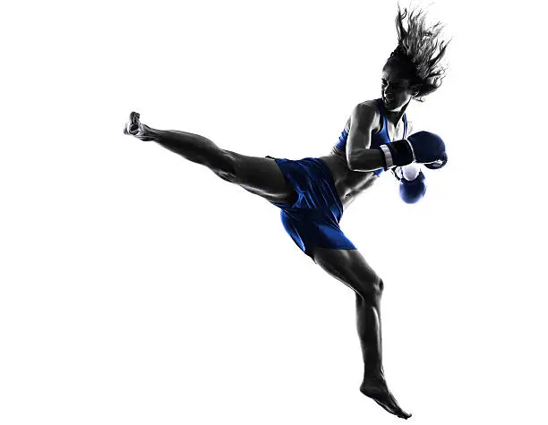 one woman boxer boxing kickboxing in silhouette isolated on white background
