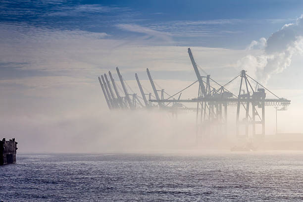 istock Container Cranes in the Fog 528393323