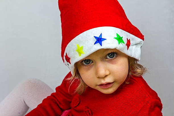 istock Happy small girl in Santa hat 528393603