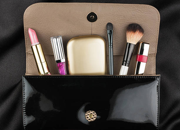 istock Black patent leather bag  with cosmetics 528395341