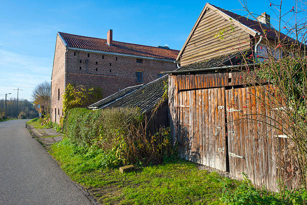 istock House along a road through the countryside 528410963