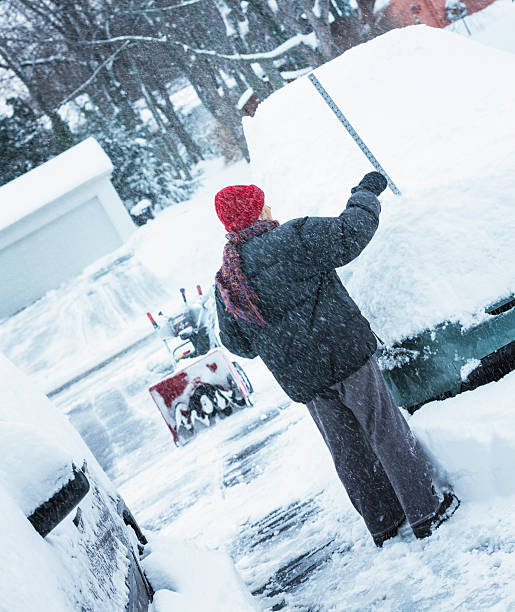 istock Deep Snow Measured On Car By Winter Woman 528411459