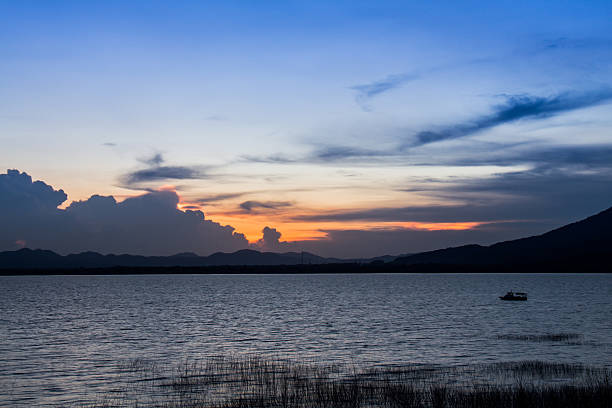 istock Boat on a sea  at twilight time 528411913