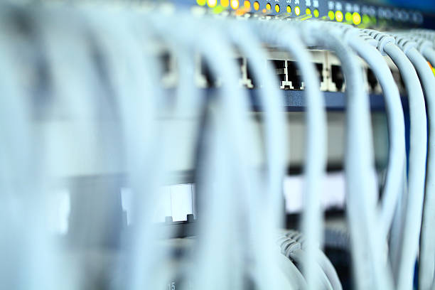 Network Connection Plug Network cable is properly directed to their designated ports. broadband isp stock pictures, royalty-free photos & images