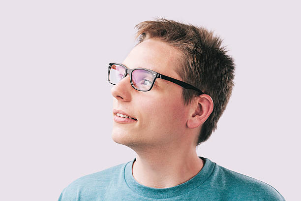 istock Portrait of young man looking away 528416418