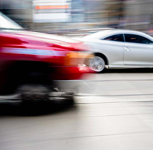 istock Red car in the street 528417139