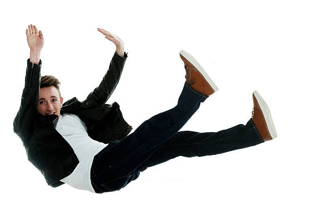 istock Smiling casual man falling and jumping 528417176