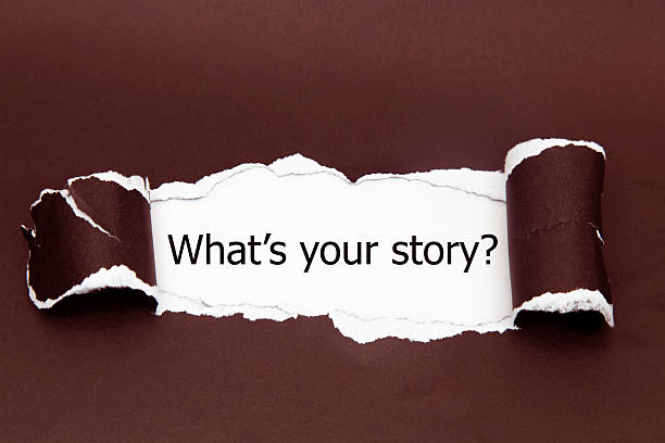 istock Text 'What's your story?' appears under the torn paper. 528417828