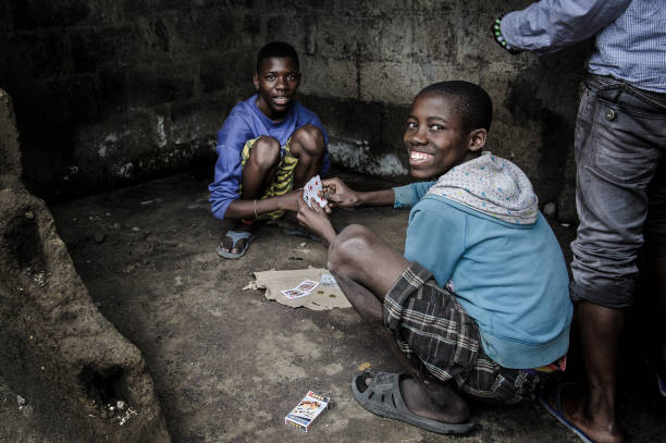 Teens Playing Cards in Misisi stock photo
