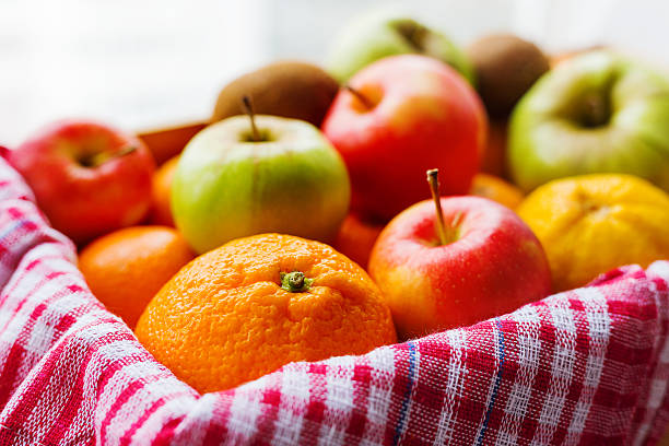 istock Box full of fresh fruits - apples, oranges, lemon. 528418310