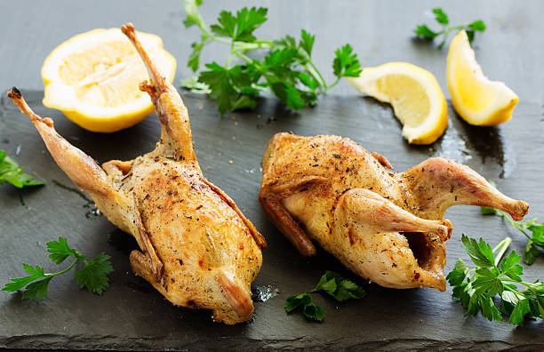 istock Delicious fried quail with herbs and greens. 528419262