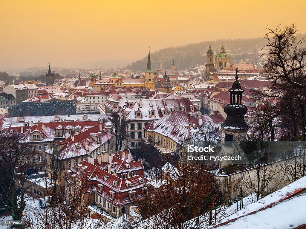 Prague Lesser town in winter time Houses and towers of Lesser town in Prague in winter time evening, Prague, Czech Republic  Aerial View Stock Photo