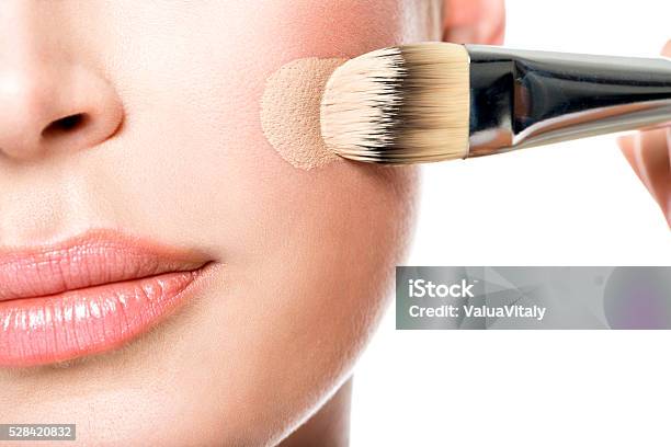 Makeup Artist Applying Liquid Tonal Foundation On The Face Stock Photo - Download Image Now