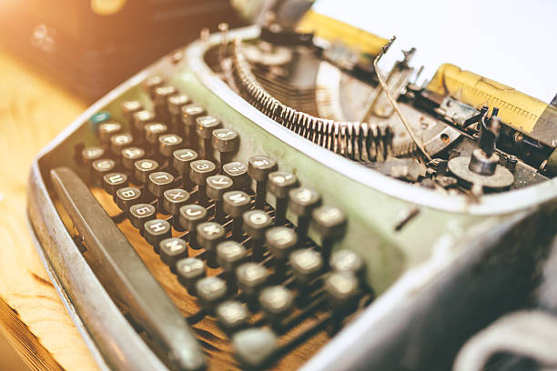 antique typewriter close up picture of an antique typewriter with cyrilic letters typewriter writing retro revival work tool stock pictures, royalty-free photos & images