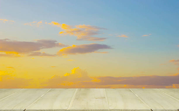 istock wooden table with The sky at sunset 528422974