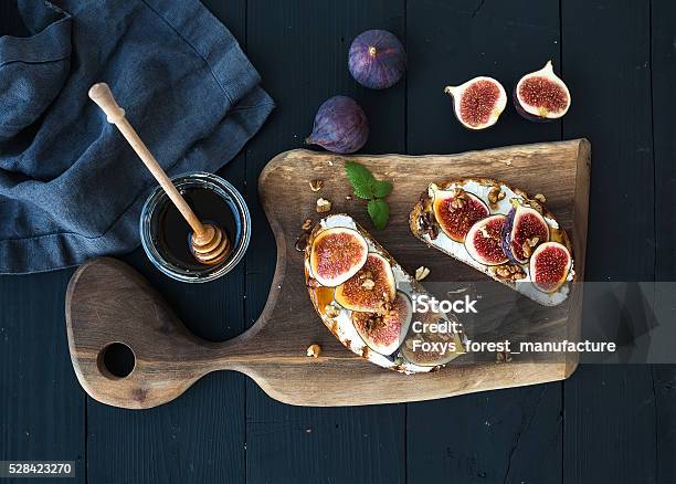 Sandwiches With Ricotta Fresh Figs Walnuts And Honey On Rustic Stock Photo - Download Image Now