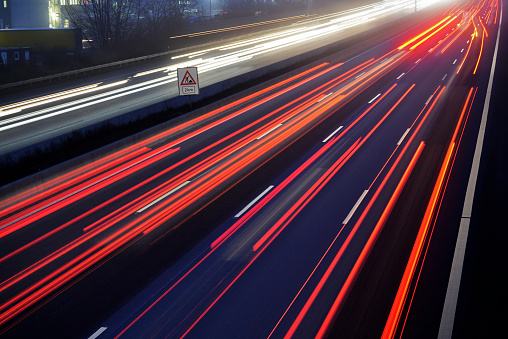 light trail view at a busy highway at dusk