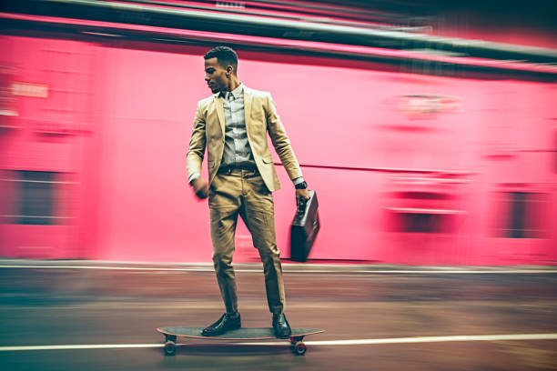 istock businessman in hurry on longboard 528423628