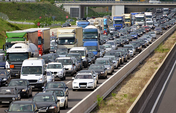 traffic jam on highway traffic jam during rush hour on multi-lane motorway autobahn stock pictures, royalty-free photos & images