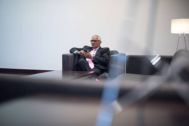 istock Mature Handsome Indian Businessman texting 528424102