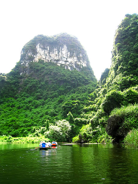 istock Unidentified tourists in Trang An 528424953