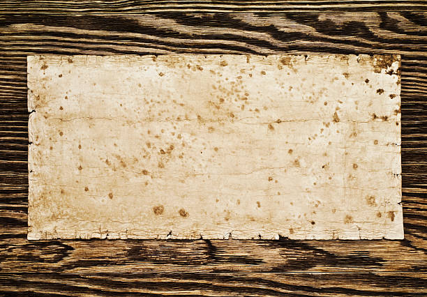 istock Old paper on the wood background 528426115