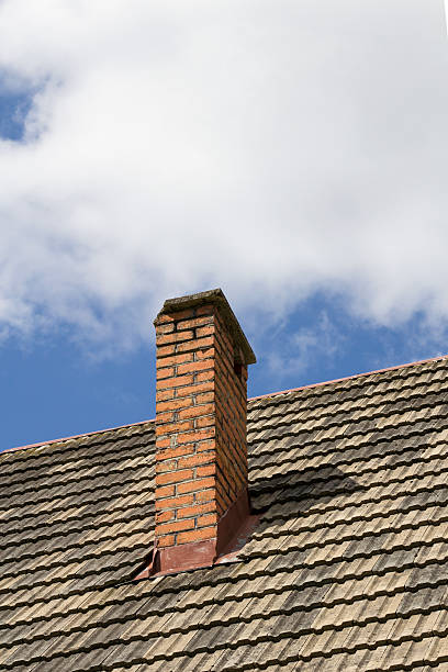 istock brick chimney on the roof 528426481