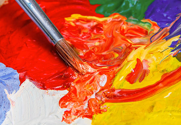 istock Single brush with the paint on the color palette 528426817