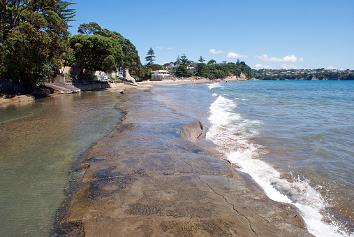 The Coastal Meander or Concrete Causeway from Mairangi Bay, in Auckland's North Shore City Region, at High Tide.