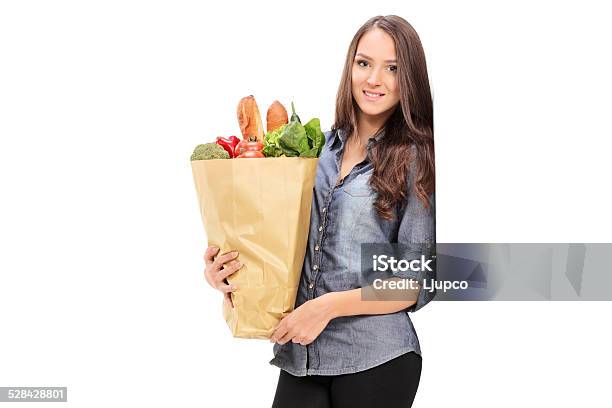 Young Girl Holding A Grocery Bag Stock Photo - Download Image Now - 20-29 Years, Adult, Adults Only
