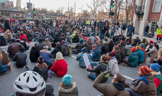 Boston, MA, USA-December 13, 2014: Protesters march and sit in a major intersection in Boston next to the Boston Common as part of the recent national protests.