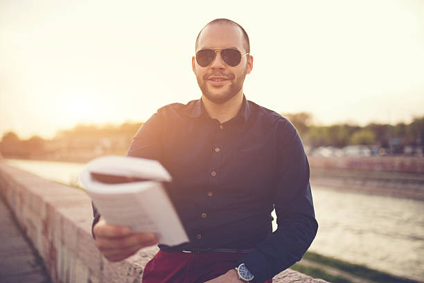 istock Man gives you a book 528429054