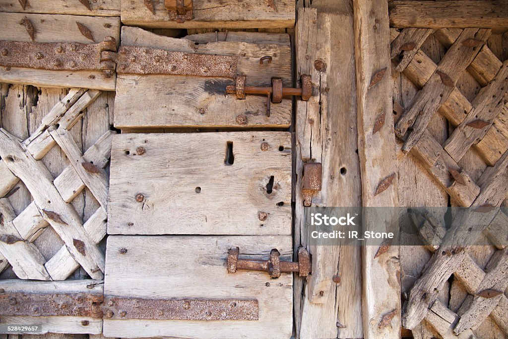 600 years old wooden doors with metal frame work 600 years old wooden doors with metal frame work and lock Aging Process Stock Photo
