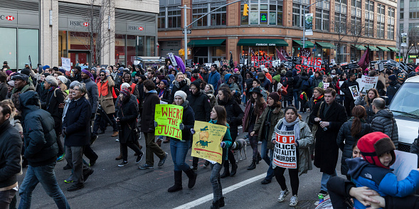 New York, NY USA - December 13, 2014: Angry protesters march against police brutality and grand jury decision on Eric Garner case on 6th Avenue