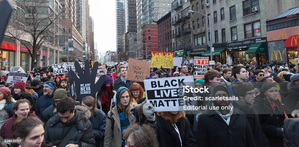 Protest in New York New York, NY USA - December 13, 2014: Angry protesters march against police brutality and grand jury decision on Eric Garner case on 6th Avenue Racism Stock Photo