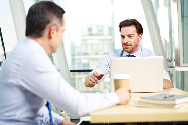 corporate people discussing business in office stock photo